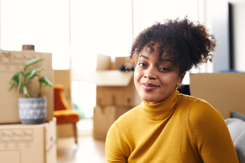 A happy young woman in her new home