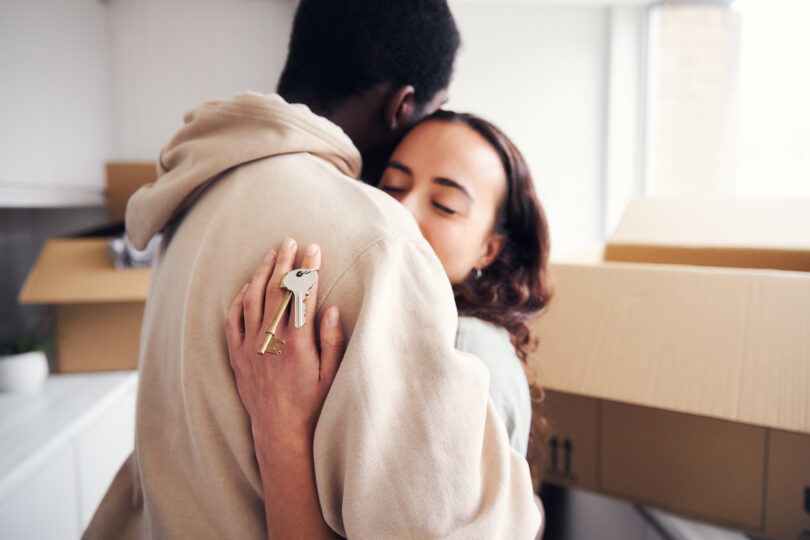 Close-up of estate agent handing house keys to new homeowner