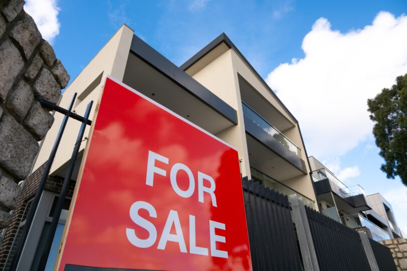 For sale sign outside a residential property in the UK, representing falling house prices in 2025