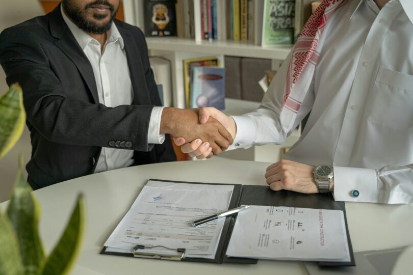 Mortgage broker meeting clients in UK office discussing Santander for Intermediaries mortgage options
